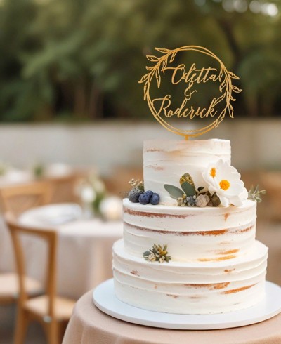 Vue d’ensemble cake topper personnalisé avec des noms sur couronne de laurier