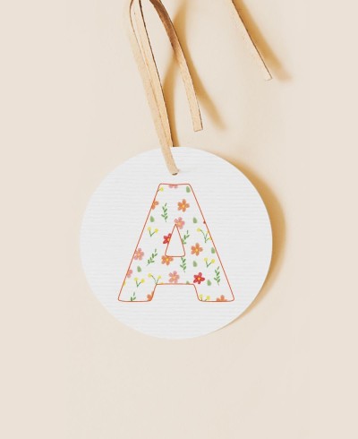 Round label for initial baptism details flowers