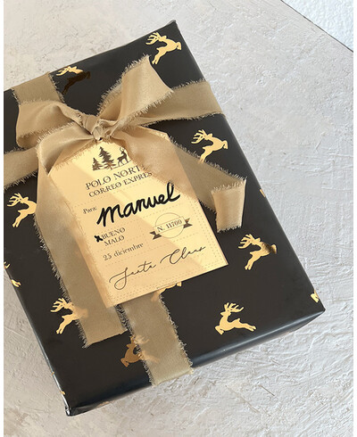 Black wrapping paper with reindeer in gold