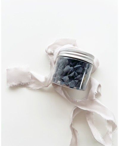 Jar with dark blue flowers to decorate stamps