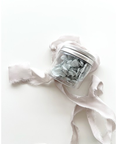 Jar of dried flowers in powdery blue color