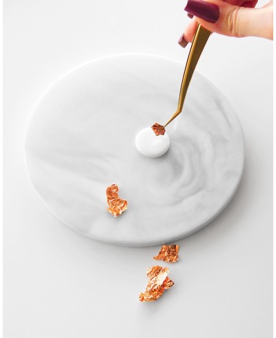 Placing silver flakes on hot wax