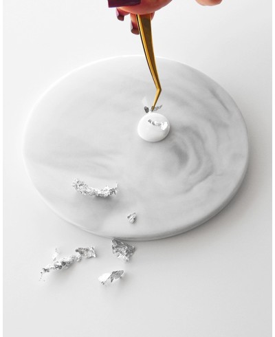 Placing silver flakes on hot wax