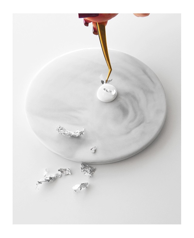 Placing silver flakes on hot wax